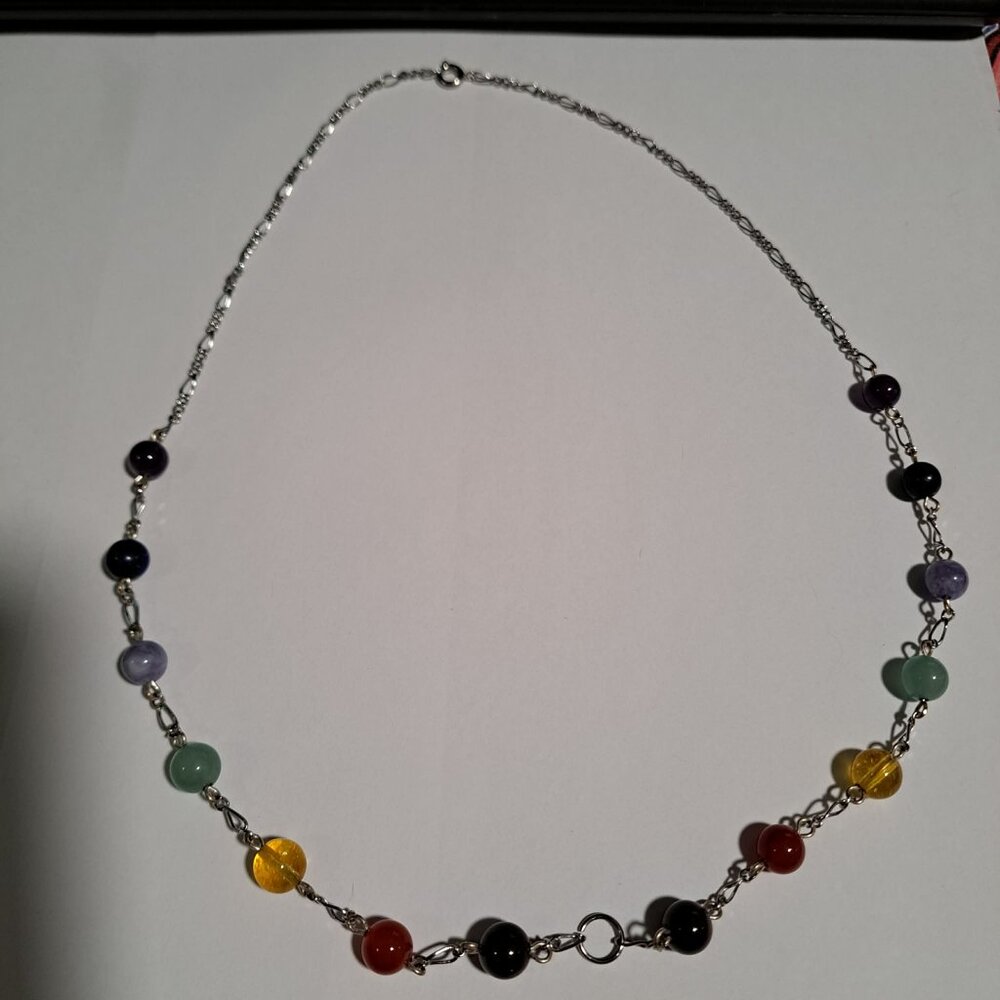 Rainbow colored stones / beads on a metal silver color chain necklace